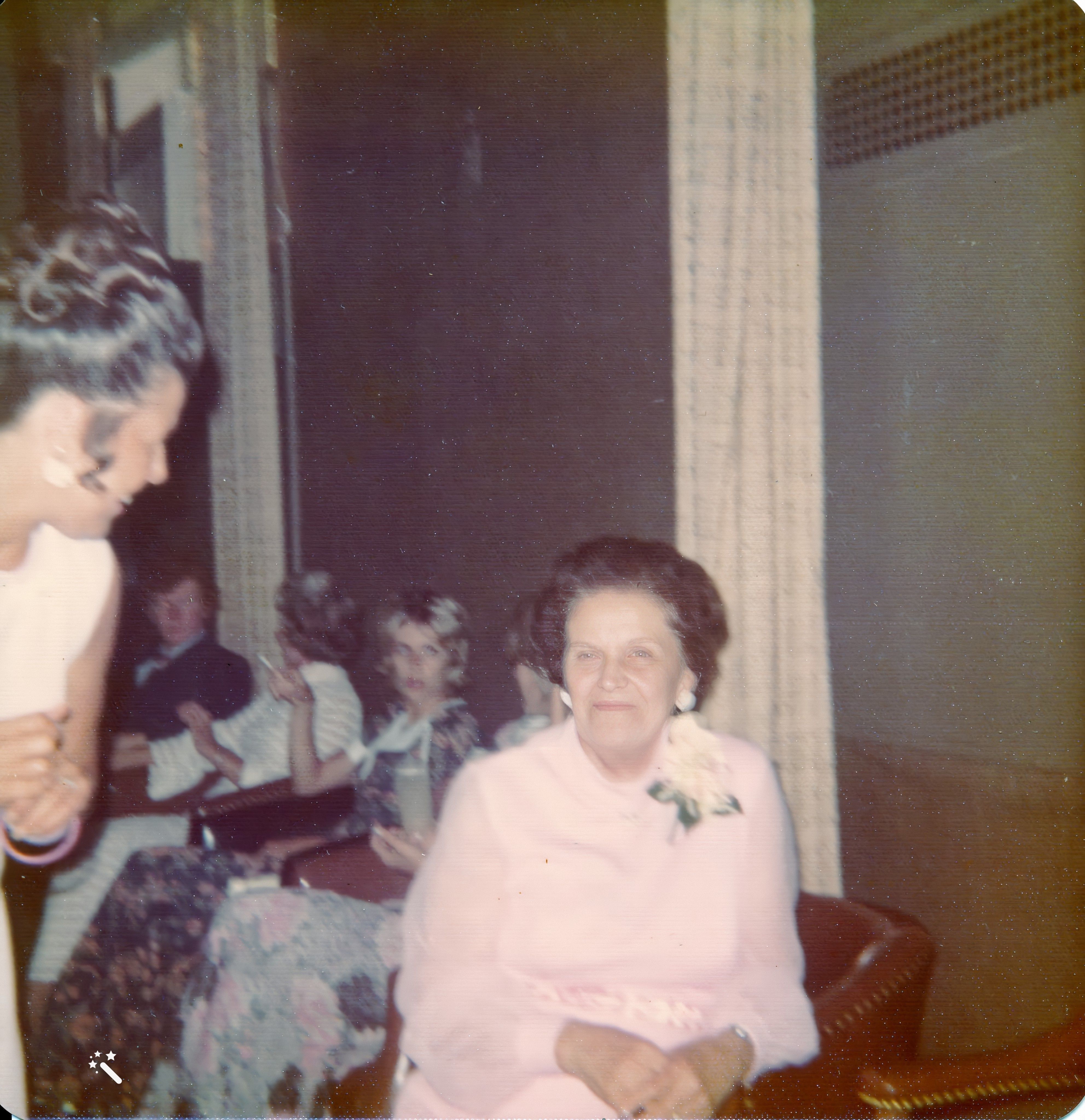 Edith sitting at the wedding recption