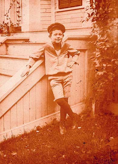 Philip standing by stairs outside